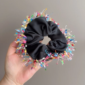 Satin scrunchie with colorful fringe trim, elegant black fabric hair tie for women