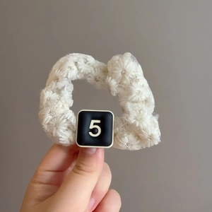 Elegant white lace floral scrunchie with embroidered flower design for ponytail styling