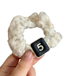 Elegant white floral lace scrunchie with black square number 5 charm for hair styling