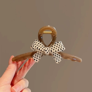 French polka dot bow hair claw clip in amber brown acrylic with classic patterns