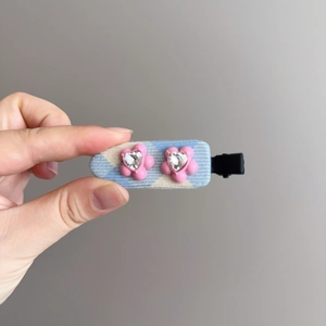 Blue and white checkered hair clip with pink flowers and heart-shaped rhinestones