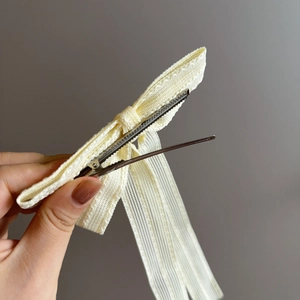 Elegant cream yellow ribbon bow hair clip with long streamers and non-slip alloy duckbill
