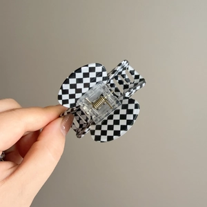 Handheld vintage checkerboard pattern hair claw clip with black and white acetate finish