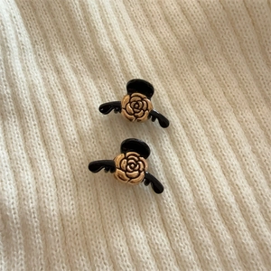 Elegant pair of French vintage black and gold rose hair claws for women hair styling
