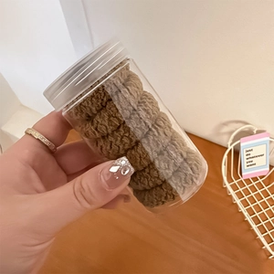 Brown textured plush hair ties set of six pieces stored in a clear plastic jar