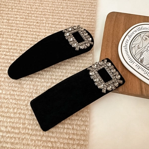 Elegant black velvet hair clips with sparkling rhinestone buckles in a two-piece set