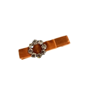 Elegant caramel velvet hair clip featuring a circular grey rhinestone embellishment