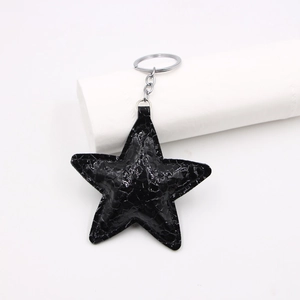 Star-shaped black faux crocodile leather keychain with polished silver metal ring