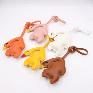 Quirky 3D leather roasted duck bag charms in orange, pink, yellow, white, and brown colors