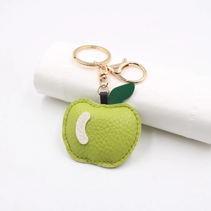 Green PU leather apple-shaped keychain with lychee texture and golden metal clasp