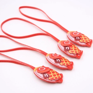 Set of four red koi fish lucky charms with detailed embroidery and long hanging cords