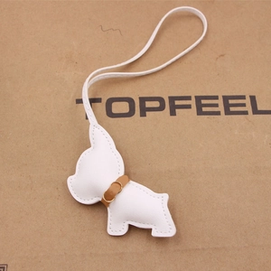 Minimalist white leather French Bulldog bag charm with brown collar and long lanyard