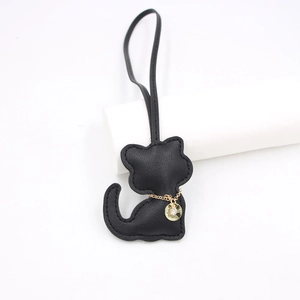 Black leather cat bag charm with gold Lucky pendant and lanyard for accessories