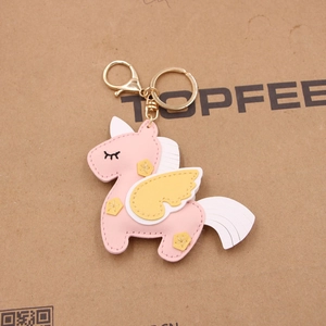 Pink handmade leather unicorn keychain with gold spring hook and yellow wings
