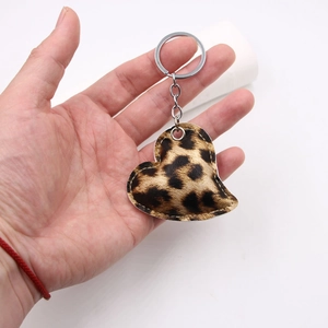 Handheld leopard print heart-shaped leather keychain with silver metal ring