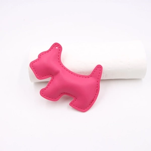 Detailed view of pink leather Schnauzer bag charm with precise stitching and hanging hole