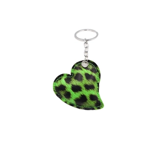 Green leopard print heart-shaped leather keychain with metal ring on white background