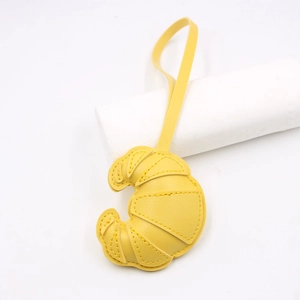 Creative yellow leather croissant charm with quilted texture and long lanyard for bags