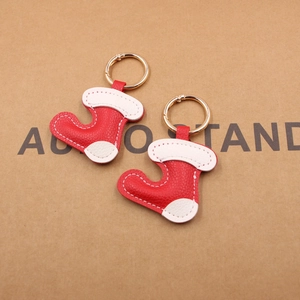 Christmas stocking leather keychain in red and white with gold metallic ring hardware