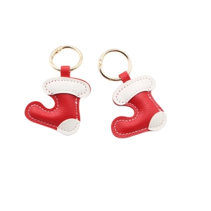 Christmas stocking leather keychain in festive red and white with gold lobster clasp