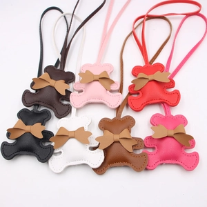 Cute PU leather bear bag charms with bowknot and lanyard in seven assorted colors