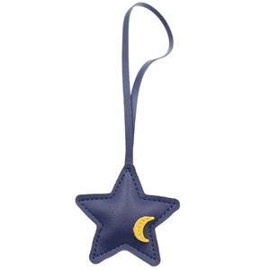 Deep blue leather star and yellow moon bag charm with textured litchi grain finish
