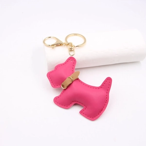 Detailed view of the dark pink faux leather schnauzer keychain with gold alloy lobster clasp