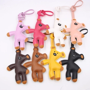 Handmade leather giraffe bag charms in eight colors with stylish contrast stitching