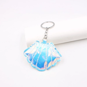 Detail of laser iridescent shell keychain with gradient blue-purple finish and silver ring