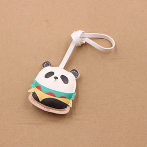 Ciondolo creativo per borsa in pelle panda burger con cinturino bianco su fondo marrone