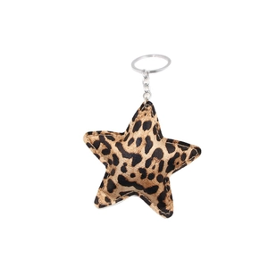 Leopard print star-shaped leather keychain charm with silver metal ring on white background