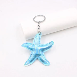 Holographic blue starfish leather keychain with silver metal ring and premium stitching