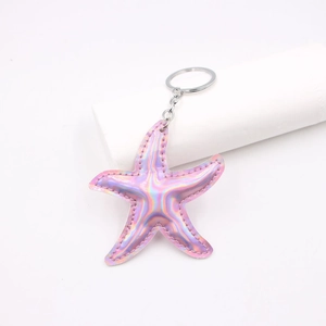 Quilted pink starfish leather keychain with iridescent laser finish and metallic keyring