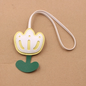 Multilayer leather tulip bag charm with yellow petals and green base on long lanyard