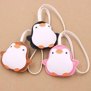Three leather penguin charms in black brown and pink with white straps for bags