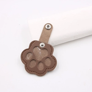 Brown cat paw leather keychain with transparent window and metal snap button closure