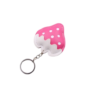 Pink and white leather strawberry keychain accessory with silver metal ring and chain