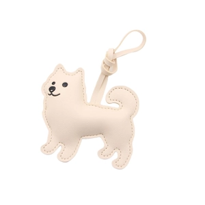 Cute cream leather dog keychain charm for bags with premium stitching and minimalist design