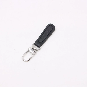 Detail of black leather zipper puller with silver swivel lobster clasp for bags and DIY crafts