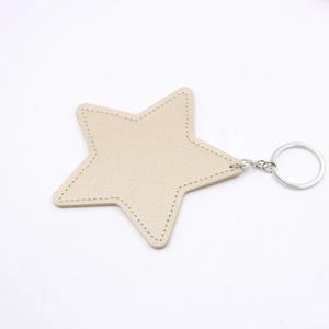 Flat champagne gold star leather keychain with decorative stitching and silver metal ring