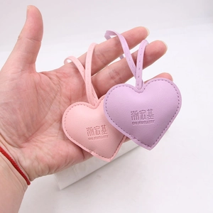 Litchi pattern leather heart pendants in pink and purple with elegant long cord straps