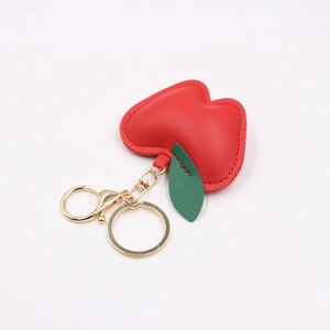 Creative red leather apple keychain with green leaf and golden metal clasp for bags