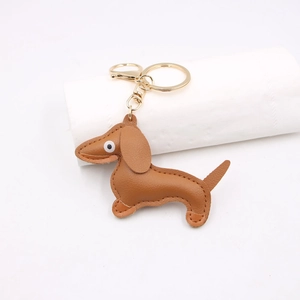Minimalist brown leather dachshund keychain with gold metal clasp for bags and keys