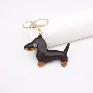 Exquisite brown leather dachshund keychain charm with golden metal hook for handbags