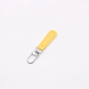 Detail of yellow leather strap with silver swivel lobster clasp and matching stitching