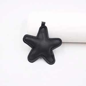 Black lychee texture leather star pendant with fine stitching for bags and keyrings