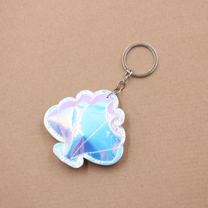 Iridescent seashell leather keychain with silver metal ring and decorative white stitching