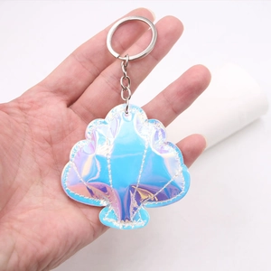 Shell-shaped laser PVC keychain with colorful iridescent gradient finish and white stitching