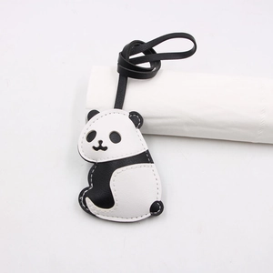 Detail view of panda leather charm with contrast stitching and durable black lanyard cord