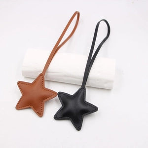 Minimalist star leather charms in black and brown with premium stitching for bags
